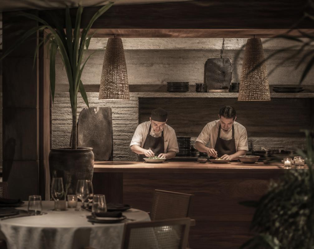 Chefs plating quietly at the timber pass